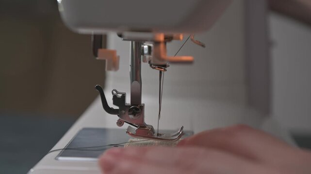 Crafting handmade garments using a sewing machine in a cozy workspace