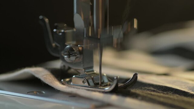 Sewing machine in action creating detailed stitches on fabric at a crafting studio