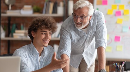 Obraz premium Grandfather and grandson share a happy moment together at the workspace