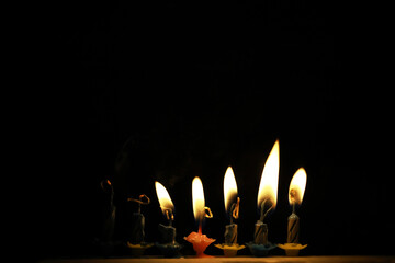 Five Lit Birthday Candles in Dark Background - Celebration, Festivity, Minimalist Stock Photo