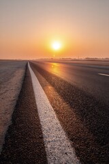 Sunrise On Wet Asphalt Road