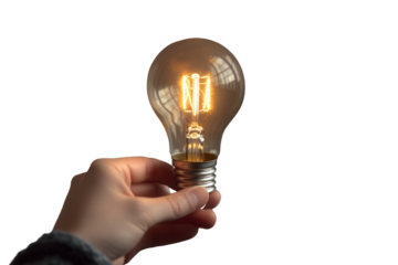 Hand holding glowing light bulb with transparent background showcasing energy and creativity in unique lighting design