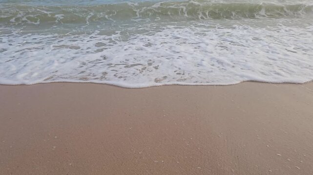Sea waves on the beach on a clear day