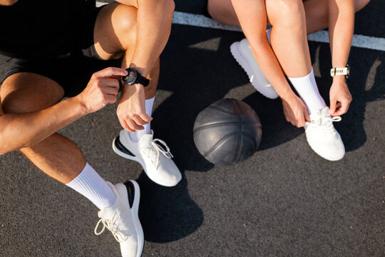 Engaging in a basketball warm-up routine on the court with friends before a spirited game - Powered by Adobe