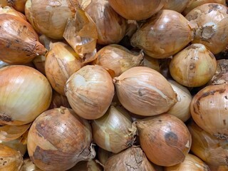Pile of onions backgrond top view.