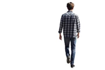 Young man walking away in a casual outfit against a plain background during daytime