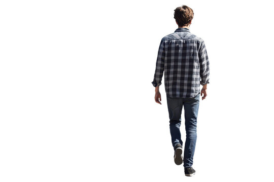 Young man walking away in a casual outfit against a plain background during daytime