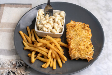 baked cod  with  macaroni salad  and fries