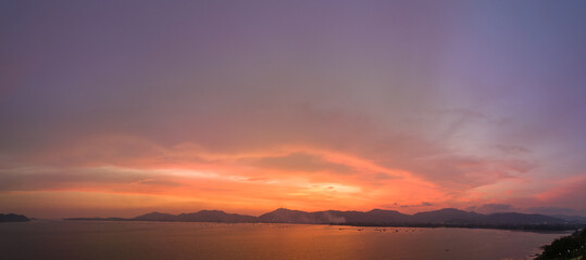 
aerial view stunning sky in sunset above the sea.
colorful cloud in bright sky of sunset above the ocean at Khao Khad Phuket. 
Majestic sunset or sunrise landscape Amazing light of nature background.