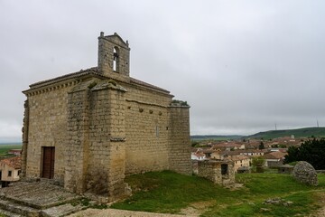 Obraz premium Ermita de Santiago on a hilltop overlooking the village of Ampudia, Palencia