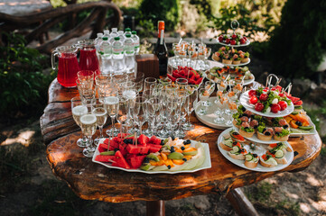 Food photography. Buffet, catering at a festive banquet of fresh fruits, vegetables, snacks with champagne.
