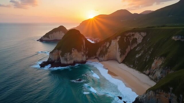 Aerial. Magnificent summer beauty of rocky cape, with sheer cliffs and beaches at sunset