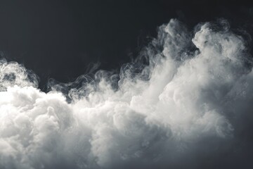 Obraz premium Soft white fog or smoke swirls elegantly across a dark background enhancing visual depth and intrigue in a mysterious atmosphere ideal for creative projects