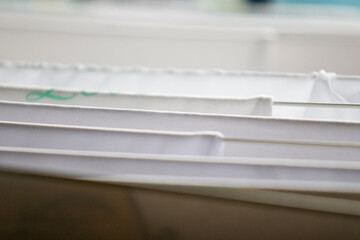 Washed white clothes on a hanger.