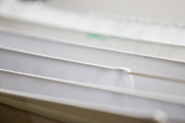 Washed white clothes on a hanger.