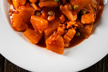 Chicken with pineapple in sweet and sour sauce. Asian food. Chinese cuisine