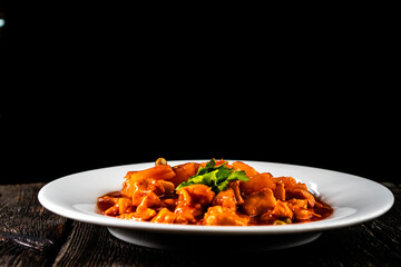 Chicken with pineapple in sweet and sour sauce. Asian food. Chinese cuisine