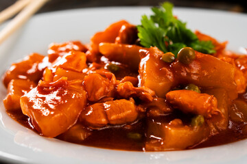 Chicken with pineapple in sweet and sour sauce. Asian food. Chinese cuisine