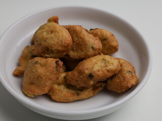 Tofu fritters, piled on white plate