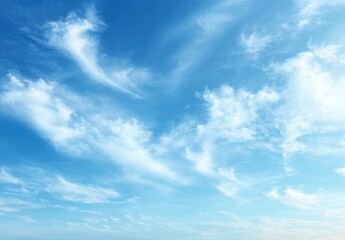 Obraz premium Bright blue sky filled with delicate white wispy clouds evoking a calm and peaceful atmosphere