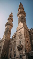 Obraz premium Majestic mosque towers rise against clear sky