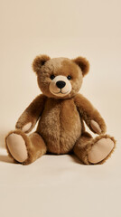 Obraz premium A cute plush teddy bear sits alone on a cream backdrop, soft fur and classic look evoke feelings of childhood comfort