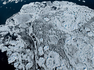 Aerial view of broken sea ice near Svalbard, showcasing the fragile yet striking beauty of the...