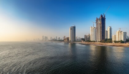 Obraz premium morning view of mumbai coastline with skyscrapers under construction and clear sky