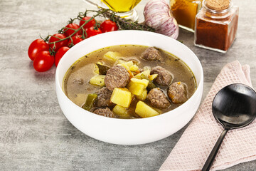Soup with meatball and potato