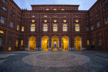 Exploring the elegant courtyard of Palazzo Carignano in Turin, Italy during twilight