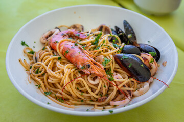 Plate of seafood pasta with shrimp and mussels in Marsaxlokk.