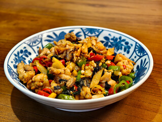 a bowl of stir fried bullfrog
