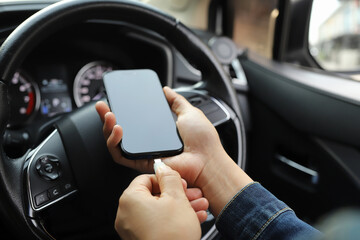 Plug to charge mobile phone in the car.