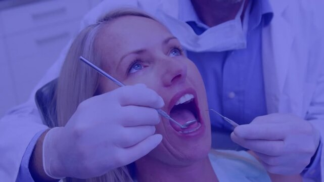 Animation of pattern and purple tint over female patient in dentist chair