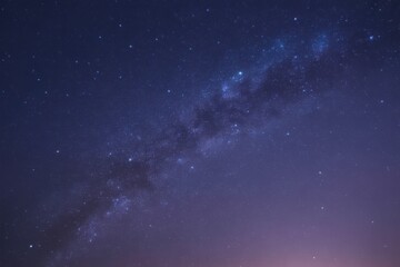 Vast cosmic tapestry of the milky way galaxy illuminated against a deep purple night sky