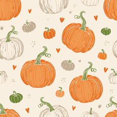 Seamless autumn pattern with orange pumpkins, green leaves, and decorative dots. Cozy seasonal design perfect for fall, Thanksgiving, and harvest themes