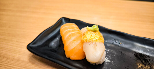 Sushi on a black plate Japanese food