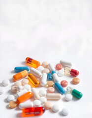 Many different pills on white background. Copy space. Concept of pharmaceuticals, medicine. Banner, angled photoshot. isolated with white highlights