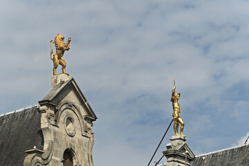 Guildhalls with gold statue on the roof on The Grote Markt, the Big Market the central square of...