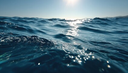 Deep blue ocean waves, sunlit surface