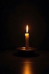 Single candle flame illuminating the darkness symbolic of hope remembrance peace and reflection in a meditative atmosphere