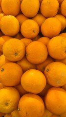A Close-up View of a Pile of Bright Oranges
