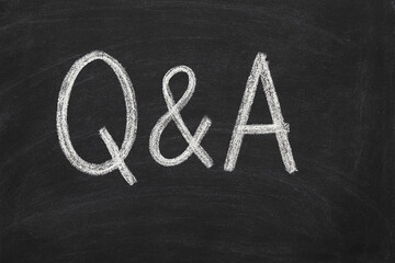 Questions and answers written on a chalkboard surface