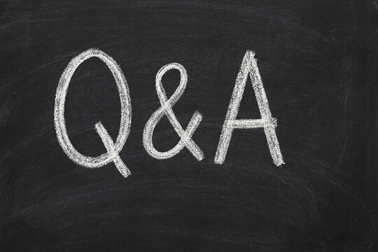 Questions and answers written on a chalkboard surface
