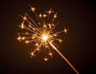 Single Glowing Sparkler Burning in Darkness