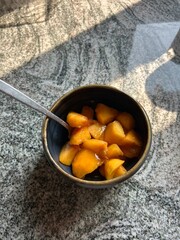 bowl of sliced fresh peaches orange 