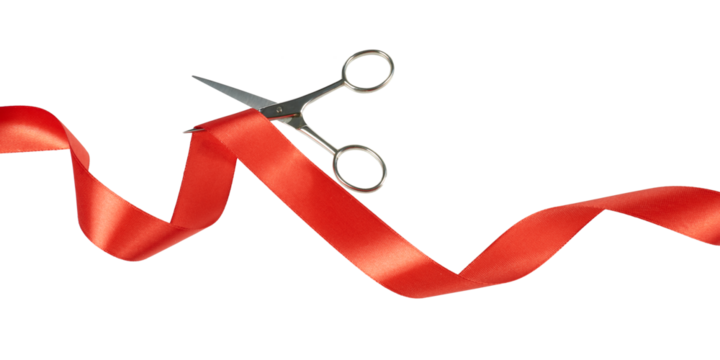 scissors cutting red ribbon band isolated on white or transparent png