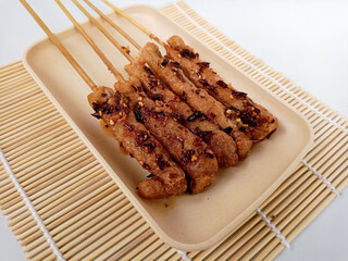 Sempol ayam, Indonesian street food made of chicken, spices, and eggs Served with chili oil.