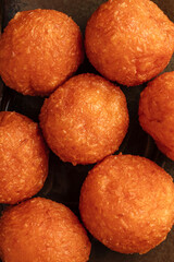 Crispy fried cheese balls served on a plate. Golden breaded snack with melted cheese inside, perfect as an appetizer or party food. Close-up of tasty deep-fried cheese bites, delicious and crunchy fin