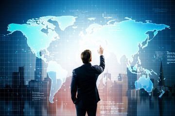 Businessman interacting with global digital interface showing world map and data on futuristic virtual screen in modern cityscape background.
